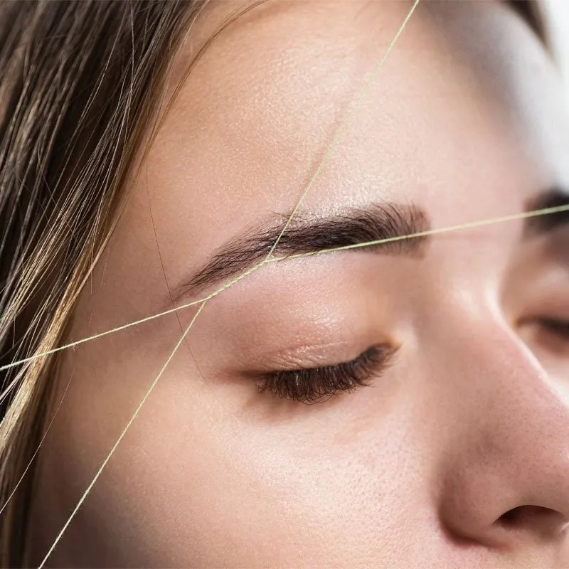 Close-up of eyebrows before and after threading, showcasing precision and natural shape