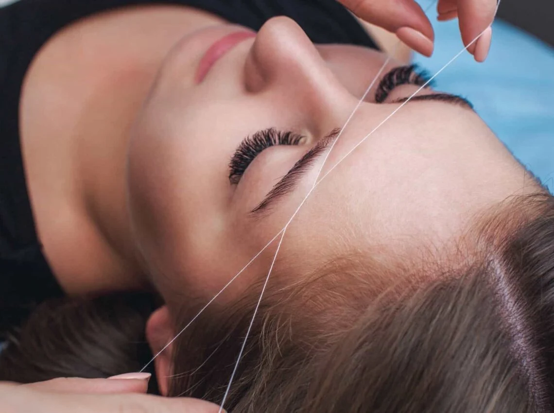 Image of eyebrow shaping service in progress at NY Brows and Threading Salon.