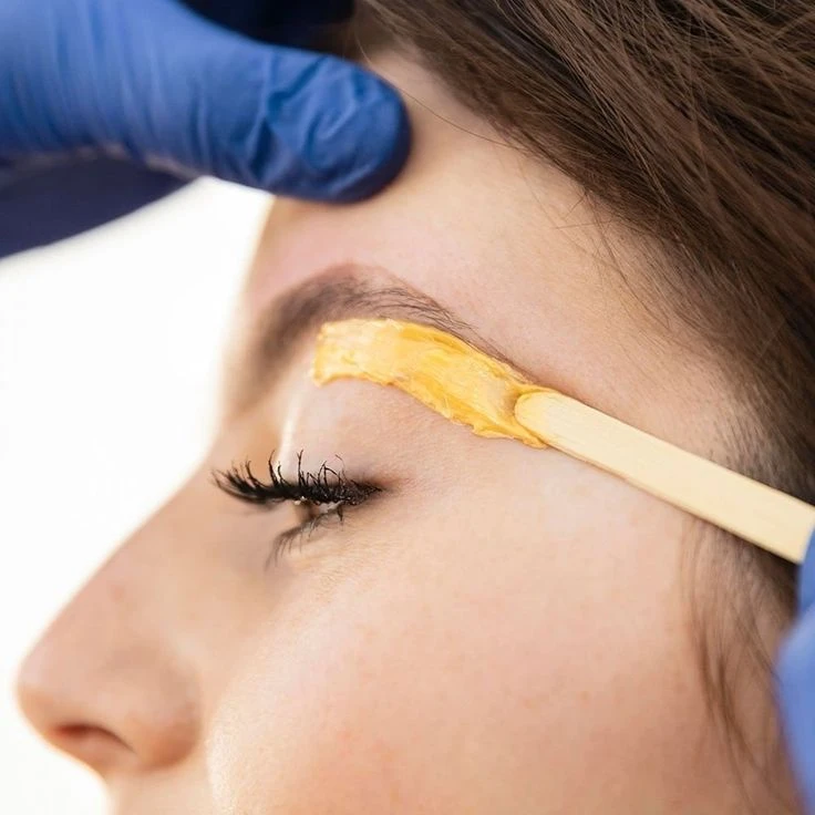 Eyebrow threading treatment performed at a brow studio serving Tribeca